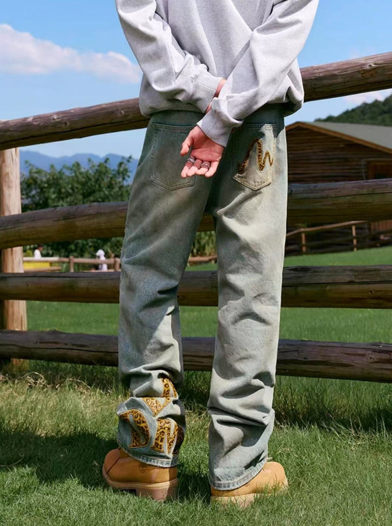 MEDM Large Letter Patch Leather Washed Ripped Jeans