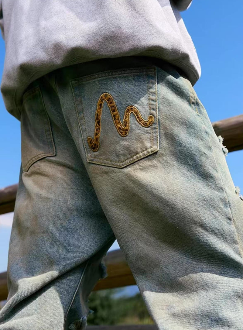 MEDM Large Letter Patch Leather Washed Ripped Jeans