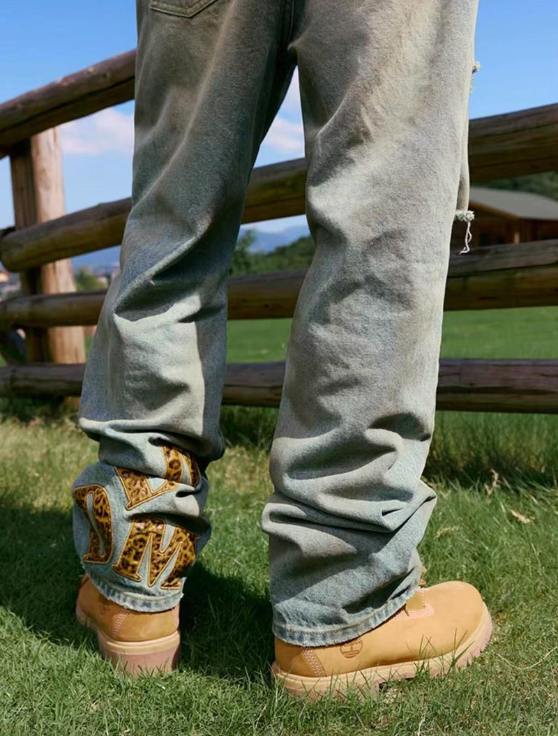 MEDM Large Letter Patch Leather Washed Ripped Jeans